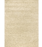 Throw it in neutral. This natural-toned area rug by Couristan is created by blending different thicknesses of soft wool yarn, blissfully plush with an ultra-thick pile that's rich in both texture and tone.