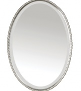 The Sherise mirror has a traditional pearl border as part of its hand-forged metal frame which features a gleaming brushed nickel finish. The elegant oval mirror has a beveled edge, and it can be hung either vertically (shown) or horizontally, depending on the space or your preference.