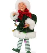 Up in lights, Santa's little helper polishes and checks each bulb for brilliance. An adorable figurine with the unmistakable style of Byers' Choice.