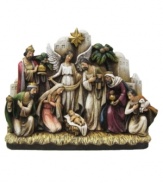 Mary and Joseph, the three magi, a shepherd, and an angel stand watch over the newborn in a traditional nativity scene. Artfully hand painted on resin, this Napco collectible figurine will serve as a reminder of the true meaning of Christmas.