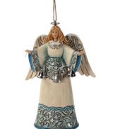 The angel we have heard on high. Set in striking blue & shimmery hues, this welcoming angel exudes a sense of peace and calm, as she stretches her arms forward and showcases a string of glistening silver bells.