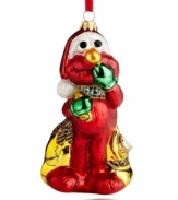 There's nothing merrier than The Muppets! Elmo is filled with the excitement of the season, carrying a bag of surprises for on and under the tree in this handcrafted Christmas ornament from Kurt Adler.