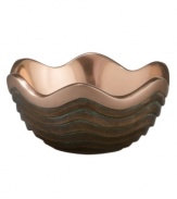 Featuring a bold new look for Nambe's signature metal, the Copper Canyon bowl captures the striking beauty of the American Southwest in brilliant copper. A rippled shape inspired by the region's wind- and water-worn canyons is finished with a rustic green patina.