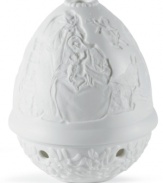 A traditional symbol of the season, this candle holder features a handcrafted nativity scene in beautiful white porcelain that glows beautifully when a candle is lit. From Lladro.