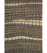 At once rustic and chic, Nourison's Fantasy rug is a stepping stone to great contemporary style at home. Hand-hooked of high-density fibers, the rug features a cobblestone-inspired pattern in tonal slate greys, lending an earthy, elemental feel to any space.