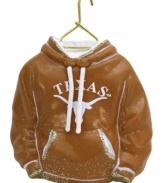 Fitting for Texas alum, this hand-painted hoodie ornament trims the tree in classic Longhorns colors. Glitter amps up the school and holiday spirit.