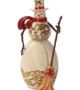 Brilliant gold and burgundy details light up this folksy snowman. With broom in hand and windswept scarf around his neck, this figurine adds new personality to the season.