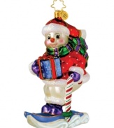 Extremely cheerful conditions on the slope turn this sporty snowman into a star. He careens down the mountain in style, dressed in head-to-toe glitter with candy cane poles and classic Christopher Radko style.