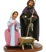 Byers' Choice recreates the very first Christmas with handcrafted figurines. Joseph and Mary crouch adoringly over baby Jesus, who rests peacefully in a crib.