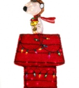 Snoopy raises the bar for Christmas decorations with the best-decked dog house on the block. A comical holiday scene, it's a head-turning sight on your front step or framed in a window. From Kurt Adler.