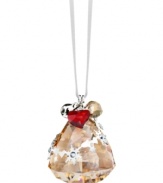 On a festive note. The bell-shaped Golden Shadow ornament sparkles in faceted Swarovski crystal with elaborate silvertone accents. Delicate, dangling charms – including a real metal bell – add extra dazzle.