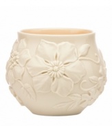 Teeming with fresh blooms in graceful ivory porcelain, Floral Fields votive candle holders from Lenox have a serene, understated elegance and simple silhouette.