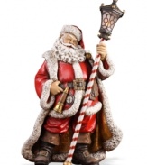 Rose-cheeked and with a joyful smile upon his face, Santa creates a festive holiday mood dressed in his traditional attire and holding a lantern.