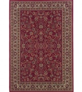 Inspired by the lovely Sarouk carpets of ancient Persia, this rug features an intricate floral motif in ivory, sage green and accents of soft blue against a rich red ground.