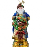 This Twelve Days of Christmas ornament from Christopher Radko features jolly St. Nick with rosy cheeks, long white beard and a dusting of sparkling glitter as he holds the first gift from the classic Christmas song, a partridge in a pear tree.