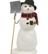 Paving the way for holiday guests, this Byers' Choice snowman carries a shovel in one hand and a corn cob-esque pipe in the other. His pristine snow glitters beneath a plaid scarf.