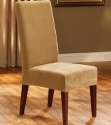 Made of soft, waffle-textured memory stretch fabric, the Stretch Pique slipcover from Sure Fit perfectly form-fits your dining room chair for a designer look.