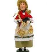 Come and get it! The artisan behind the traditional German straw ornaments calls out for curious shoppers to approach her stall. A straw hat is a most-appropriate touch to the one-of-a-kind Byers' Choice figurine.