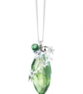 Green to envy. The cone-shaped Peridot Silver Shade ornament sparkles in faceted Swarovski crystal with elaborate silvertone accents. Delicate, dangling charms – including a real metal bell – add extra dazzle.