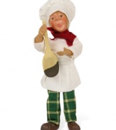 Create a stir in your holiday kitchen with a chef carrying a chocolate-dipped spoon. Plaid pants and a red scarf contrast the crisp chef's whites on this handcrafted figurine from Byers' Choice.