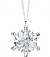 Swarovski makes winter magic with the 2012 annual snowflake ornament. Delicate cut crystal creates a flurry of sparkle and shine on your tree or hanging in a window. With dated metal charm.