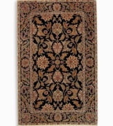 Inspired by an early 20th-century carpet woven in Turkey, the Oushak pattern of this Agra rug features an exotic palmette motif and rosette border in earth tones against a dramatic black background. Subtle gradations of color evoke the timeworn striated effect created by aged vegetable dyes. A special antique wash further harmonizes the colors into a rich vintage finish. Woven in the USA of luxuriously soft premium worsted New Zealand wool.