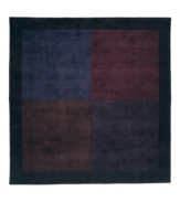 A checkerboard pattern in striking shades of purple creates a square, handcrafted rug with modern grace and style. A deep lavender border encases the design, finishing the rug with a subtle, beautiful color contrast. Made of plush wool with silk accents, which adds rich highlights and distinct texture to the rug. (Clearance)