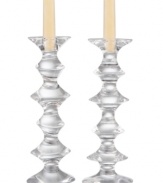 Cut in fluid, swirling tiers, Motus candle holders from Nambe shed new light on luxe crystal. Straight taper candles contrast an ultra-modern silhouette for fresh, whimsical flair. Designed by Karim Rashid.