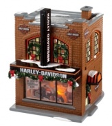 This Harley Davidson storefront combines real American spirit with the classic charm of Christmas. Snow-dusted garland, wintry wreaths and a warm brick design deck infuse this piece with small-town personality, while the front window showcases the legendary road warrior for all to see.