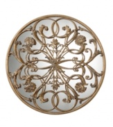 See your space blossom. Hand-forged metal with antiqued gold tones and a charcoal glaze winds and flourishes against a mirror that accentuates every detail.