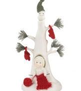 Knitting kind warmth for all, this Snowbabies figurine shows that sharing is caring. Crafted of porcelain bisque from Department 56.