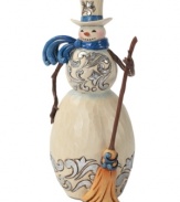 Brilliant blue details light up this folksy snowman. With broom in hand and windswept scarf around his neck, this figurine adds new personality to the season.