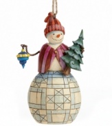 A jolly, happy soul, this snowman features a carrot nose and two eyes that look like coal. With his very own tree and ice-blue ornament. From the Heartwood Creek collection by Jim Shore.