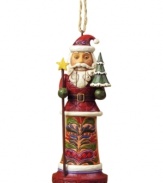 Jim Shore cracks the code on Christmas with an ornament that combines two holiday classics – St. Nick and a nutcracker! Featuring an ornately carved and patterned coat, star-topped staff and tiny tree.