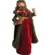 Haunting Scrooge with scenes of deprivation, the Spirit of Christmas Present inspires hope for a  better future. A lavish fellow, the Byers' Choice figurine wears a fur-lined coat and carries a cornucopia of fruit with a chalice of wine.