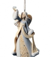 Utterly delicate and lovely, this Angel of Heart ornament sits upon your tree showering your home with gentle peace and harmony.