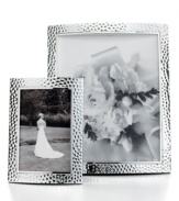 An instant update for elegant interiors, these hammered aluminum picture frames add timeless polish to any image. Two sizes create a balanced display with either portrait or landscape prints. With finished velvet backing.