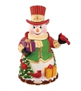 Wearing a gold-trimmed vest and top hat, the Regal Snowman cookie jar from Christopher Radko shines with incredible detail. Christmas-red cardinals, winter foliage and gifts galore will make him a favorite part of any holiday home.