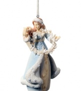 A flock of peaceful doves surrounds a spiritual angel in this Angel with Dove ornament, capturing the true spirit of the season.