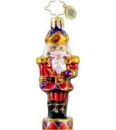 A classic nutcracker makes a grand statement upon your tree as he stands tall and proud in this hand-painted ornament from Christopher Radko.