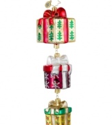 A season of giving. A trio of presents set with lovely trees, snowflakes and holly leaves exude feelings of Christmas cheer upon your tree. From Christopher Radko.