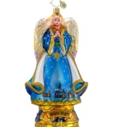 A sweet angel holds her hands in prayer in this beautiful, hand-painted ornament set in the time-honored style of Christopher Radko.