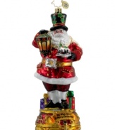 With a dash of glitter and hint of intrigue, St. Nick dazzles your tree with intricate hand-painted details and the Christmas sentiment: We Wish You a Merry Christmas. From Christopher Radko.