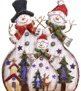 A family of three cheerful snowmen bring a touch of whimsical joy to your home during the holiday season in this delightful figurine.