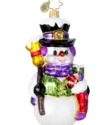 Support a worthy cause with a standout ornament. Handcrafted by Christopher Radko, this brilliant snowman wears vibrant purple accessories to bring new attention to Alzheimer's.