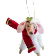 Sweet on Christmas, this snow-white lamb boasts a festive red and gold scarf and the distinct charm of Annalee ornaments.