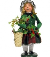 In the business of decking halls with boughs of holly, this young girl helps her mother sell the traditional red and green plants of Christmas. A beautiful figurine from the Cries of London collection, with the handcrafted charm of Byers' Choice.