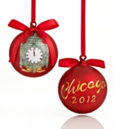 A time to cheer. Commit Christmas 2012 to memory with a glass ornament featuring the historic clock at Macy's State Street store. Shown front and back.
