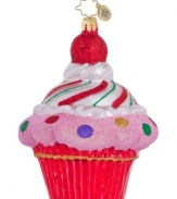 Simply irresistible, the cupcake ornament from Christopher Radko is decorated with glittery pink frosting, sprinkled with dots, topped with a cherry and entirely handcrafted in Polonaise glass.