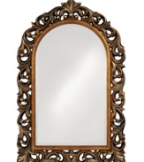 Fluid garlands curl and twist in antique bronze with gold inset, framing the arched Orleans mirror in rich, vintage grace. With an undeniable strength that looks at home amid sophisticated decor.
